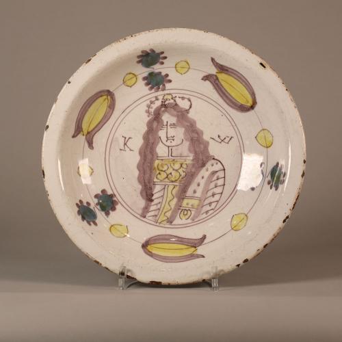 Dutch Delft faience dish, c.1700, decorated with a portrait of King William of Orange