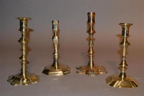 Four 18th century brass candlesticks