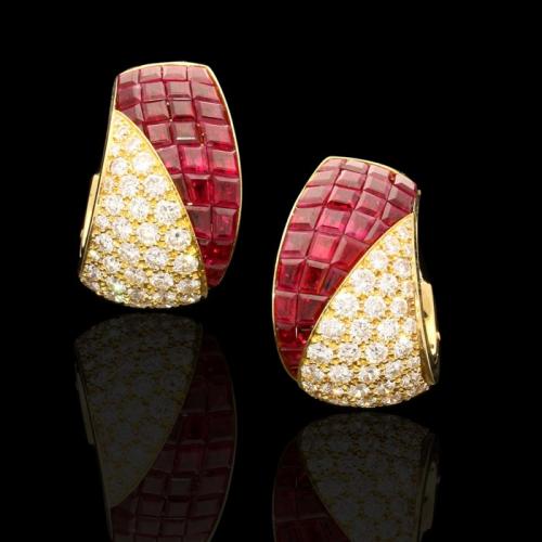 A stylish pair of 'Sertie Invisible' gold, ruby and diamond asymmetric clip earrings