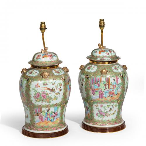 A pair of Chinese Famille Verte Vases and Covers
