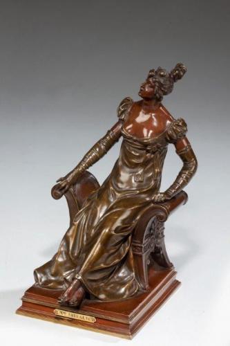  A bronze of an edwardian lady on a window seat