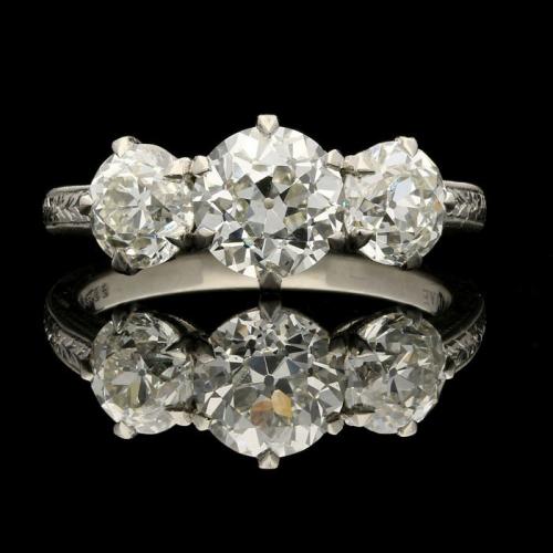 2.62ct diamond three stone ring set in finely hand engraved platinum