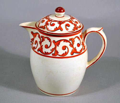 Creamware Covered Jug and cover with Orange Foliate Scroll Designs, Circa 1820