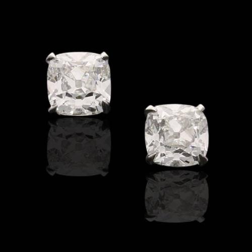 A beautiful pair of cushion shape old mine cut diamond ear studs weighing 1.42cts in total
