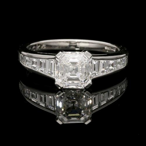 An elegant 1.66ct Asscher cut diamond ring with tapered diamond-set shoulders