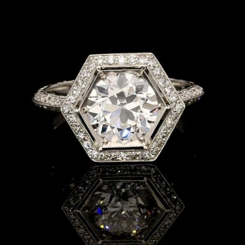 A stunning 1.83ct old European cut diamond ring with hexagonal diamond surround