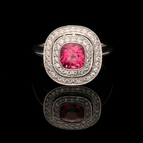 A beautiful 1.85ct vibrant pink sapphire ring with diamond double halo in platinum