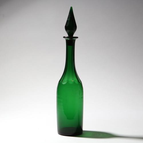 A late 19th century green glass decanter