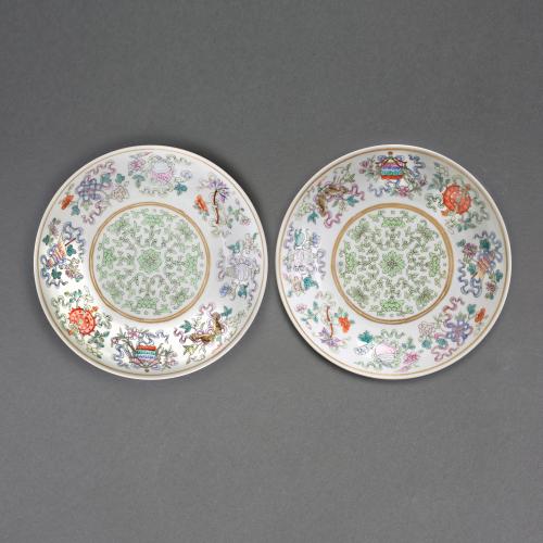 A pair of Chinese imperial porcelain famille rose enamelled fencai saucer dishes, 1862-1874