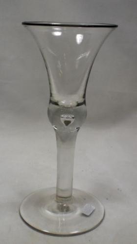 A plain stem wine glass with thistle bowl and conical foot English c.1750