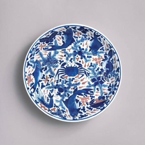 Chinese porcelain blue and white and underglaze copper-red large deep saucer dish, Kangxi period, circa 1680