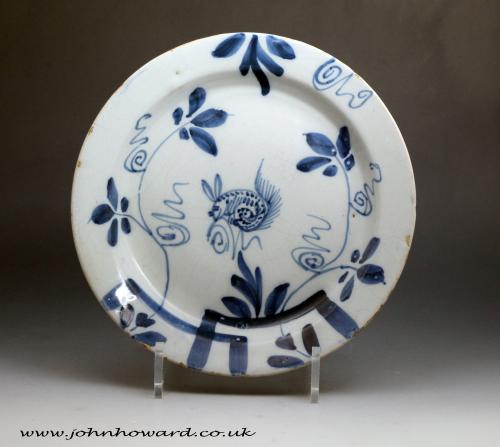 Antique English pottery blue and white plate with a painted squirrel and leaves 18th century