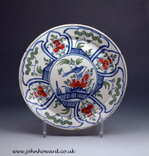 English delftware Bristol pottery plate polychrome decorated with central image of a bird mid 18th century
