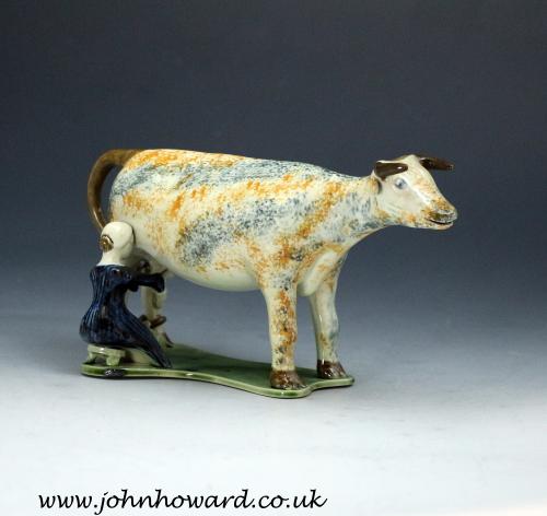 English pottery figure a hobbled cow with milkmaid circa 1810