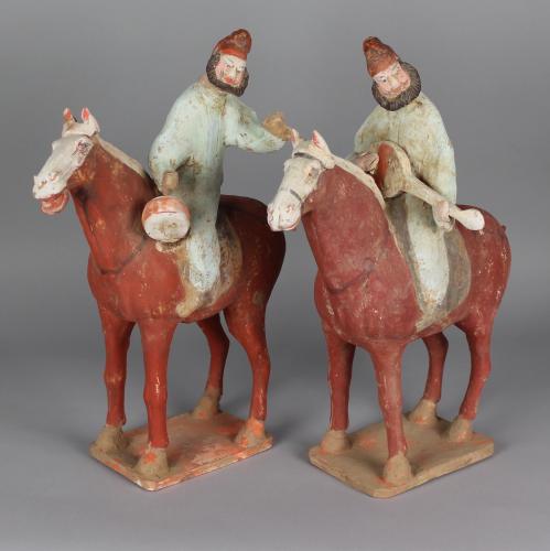 A Pair of Chinese Painted Pottery Equestrian Tomb Figures, Tang Dynasty