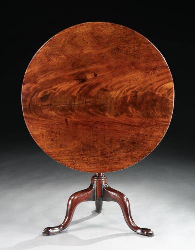 A mid-18th century mahogany tripod table