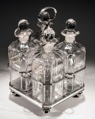 A Set of Four Gilt Labelled Georgian Decanters in Stand