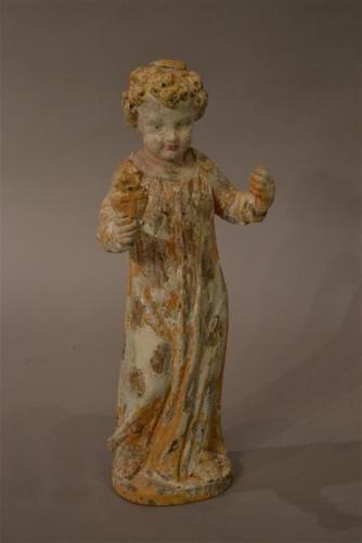 A French carved pine figure of a boy