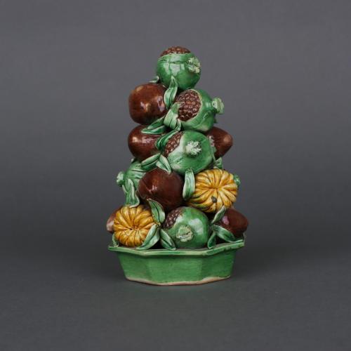 A Chinese porcelain famille verte biscuit fruit pyramid group, Early Kangxi, circa 1680