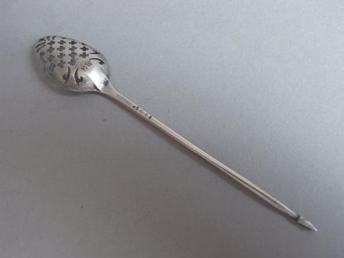 A rare George II Mote Spoon of unusual small size made in London circa 1755 by Benjamin Brewood II