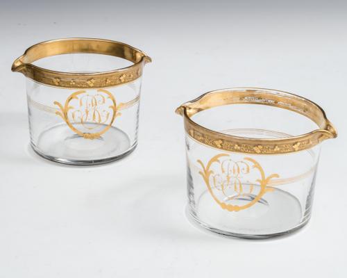 A rare pair of double lipped wine rinsers with gilt fruiting vine decoration.