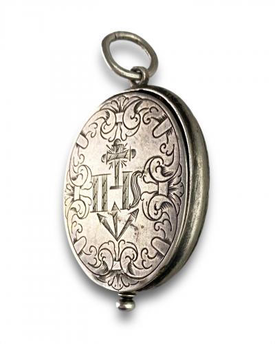 Engraved silver reliquary pendant. German, late 17th century