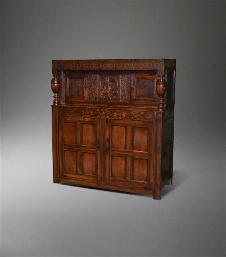 A Charles II oak two part press cupboard