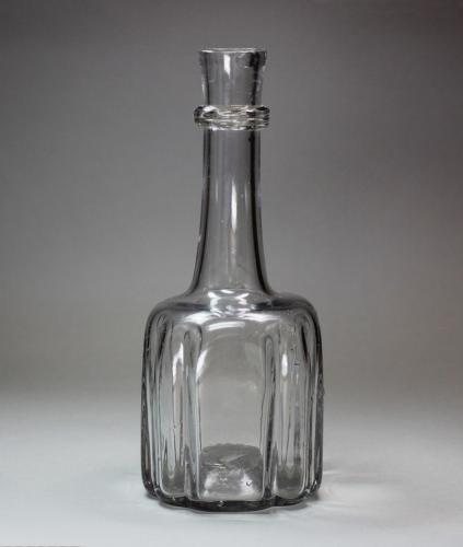 An English cruciform-shape glass decanter, mould blown, circa 1720-40