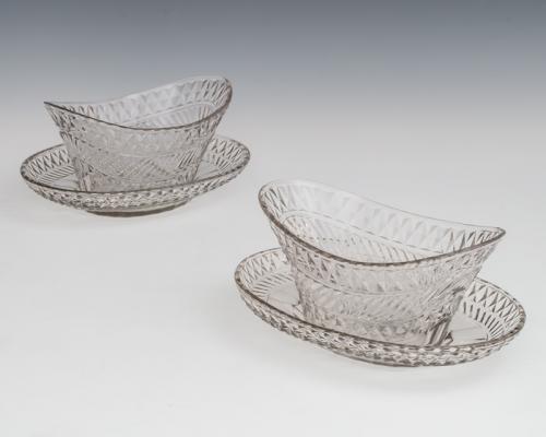 A Pair of Diamond and Mitre Cut Dishes in Stands