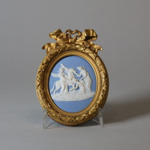Wedgwood blue jasper oval plaque sprigged in white with the 'Three Graces watering Pegasus'