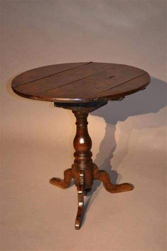 An early 18th century oak pedestal table