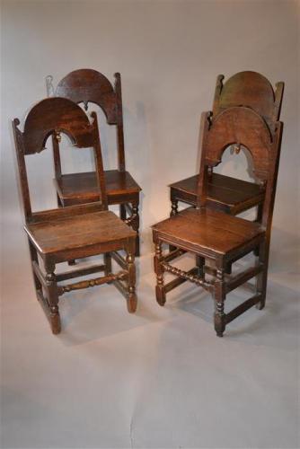 A matched set of four 17th century oak backstools