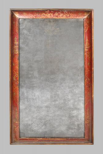 An early eighteenth century red lacquer cushion mirror with its original plate, c.1720