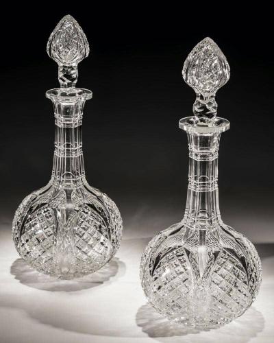 A pair of Victorian decanters cut with tulip petals and cross over diamonds