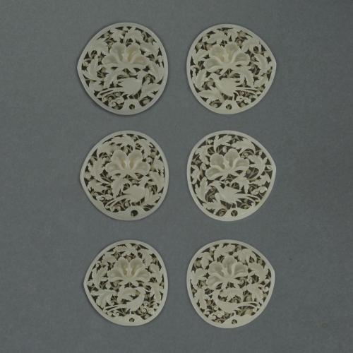 Set of six Chinese jade openwork belt plaques of peach form, Early Ming dynasty, 15th/16th century