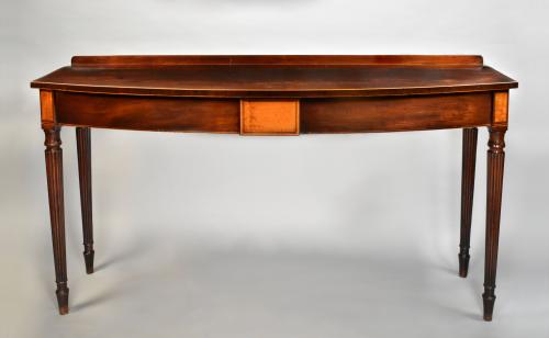 Sheraton period mahogany bow front serving table of unusually narrow proportions, c.1790
