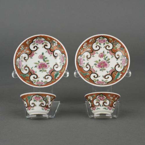 A pair of Chinese porcelain famille rose tea-bowls and saucer