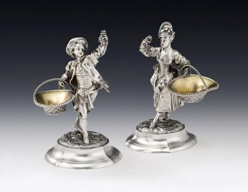 An important pair of Figural cast Pedlar Salt Cellars made in London in 1892 by Alfred Benson & Henry Hugh Webb, Retailed by Hunt & Roskell