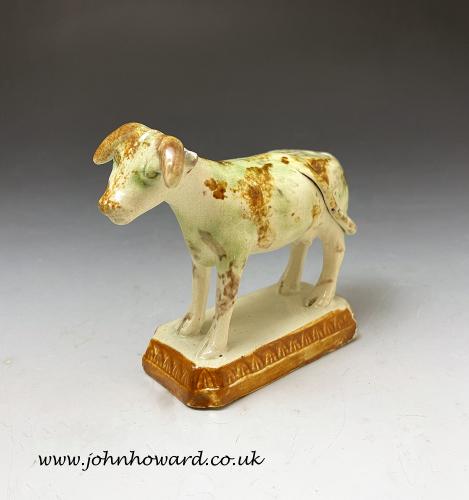 Antique English pottery creamware colored glaze figure of a cow circa 1800