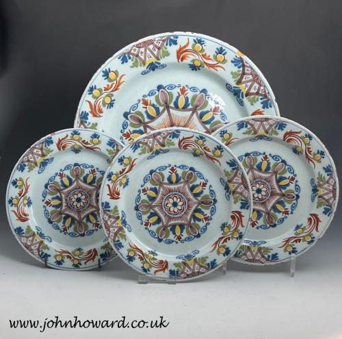 English delftware charger and plates Ann Gomm pattern late 18th century Lambeth Delftworks London