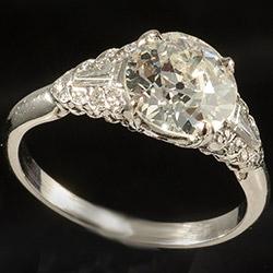 Single stone ring with diamond shoulders