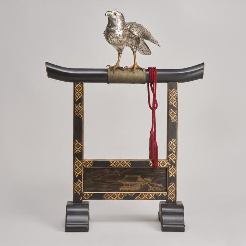 A majestic, life-size silvered Bronze Okimono of a Hawk on a superb lacquer stand, (Japanese Meiji-era)