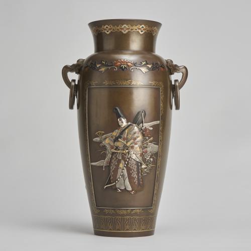 An exquisite Japanese Bronze and multi metal vase depicting a Samurai Archer