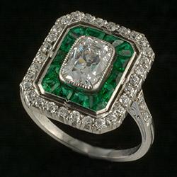 Platinum set Art Deco ring with emeralds and diamonds