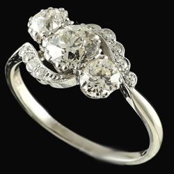 Edwardian three stone diamond crossover ring