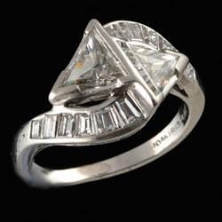 Platinum and iridium baguette and triangle diamond crossover ring
