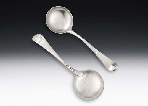 A rare pair of George II Hanoverian pattern Sauce Ladles made in London in 1751 by George Morris.