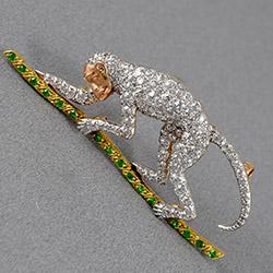 Edwardian diamond and green garnet monkey brooch