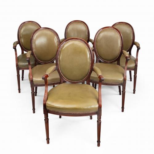 Four Edwardian mahogany chairs by Gill & Reigate