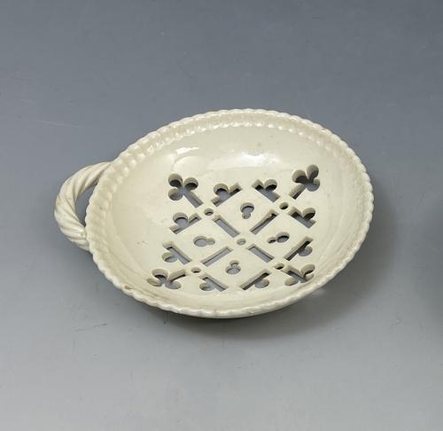 18th century English creamware pottery egg strainer, Staffordshire or Yorkshire